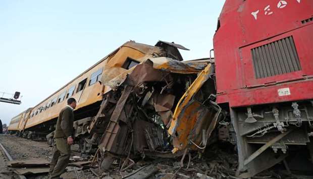 A policeman looks at the wreckage after a train crash in Kom Hamada in the northern province of Beheira, Egypt. Reuters