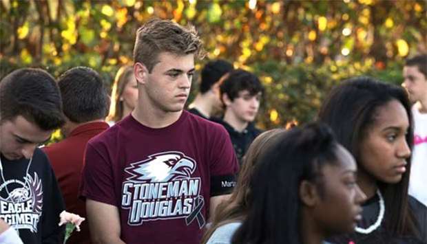 Students arrive at Marjory Stoneman Douglas High School for the first time since the mass shooting in Parkland, Florida, on Wednesday.