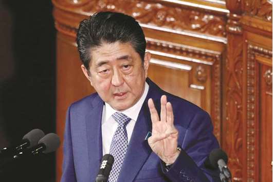 Japanu2019s Prime Minister Shinzo Abe gestures as he makes a speech at the new session of parliament in Tokyo. Abeu2019s plan to revise labour laws, a key part of his economic reforms to boost growth, is facing political headwinds after the  government admitted using flawed data to back up its proposals.