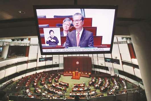 Hong Kong financial secretary Paul Chan delivers the annual budget at the Legislative Council yesterday. Hong Kong posted a provisional budget surplus of HK$138bn ($17.63bn) for the 2017/18 financial year and expects an overall surplus over the next five years, Chan said.