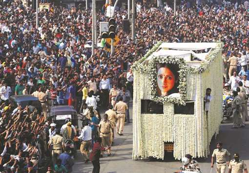 The body of Sridevi is carried in a truck during her funeral procession in Mumbai yesterday.
