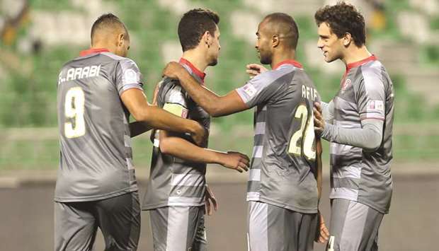 Al Duhailu2019s Youssef Msakni is congratulated on his hat-trick by his teammates yesterday.