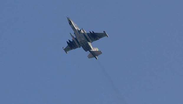 A Sukhoi-25 fighter jet flying over the Syrian city of Saraqib, southwest of Aleppo on Thursday.