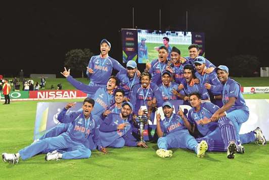 Indian players celebrate their victory in the U19 cricket World Cup final against Australia at Bay Oval in Mount Maunganui yesterday. Inset: Manjot Kalra celebrating his ton.