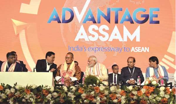 Prime Minister Narendra Modi looks on as Bhutanese Prime Minister Tshering Tobgay talks to Assam Chief Minister Sarbananda Sonowal at the Advantage Assam u2013 Global Investors Summit in Guwahati yesterday. Also seen are central ministers Ravi Shankar Prasad and Suresh Prabhu.