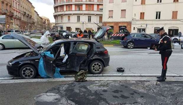 The car of the suspected shooter that opened fire on African migrants, identified as Luca Traini, 28, is seen in Macerata, Italy on Saturday.