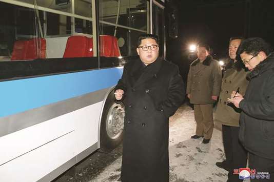North Korean leader Kim Jong-un attends the trial of a trackless tramway in Pyongyang.