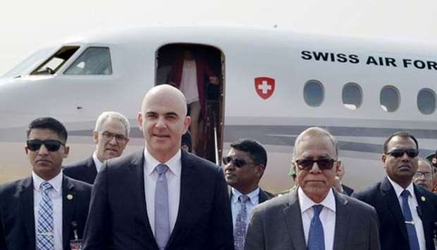 Switzerland President Alain Berset is seen with Bangladesh President Abdul Hamid at Shahjalal International Airport in Dhaka on Sunday.