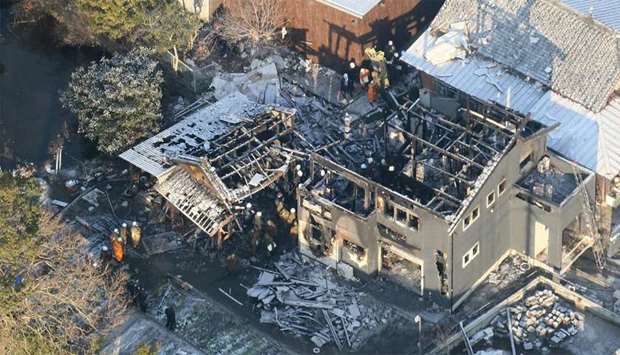 This aerial picture shows the site a day after a Japan's Ground Self-Defense Force (JSFD) AH-64 Apache attack helicopter crashed in a residential area in Kanzaki