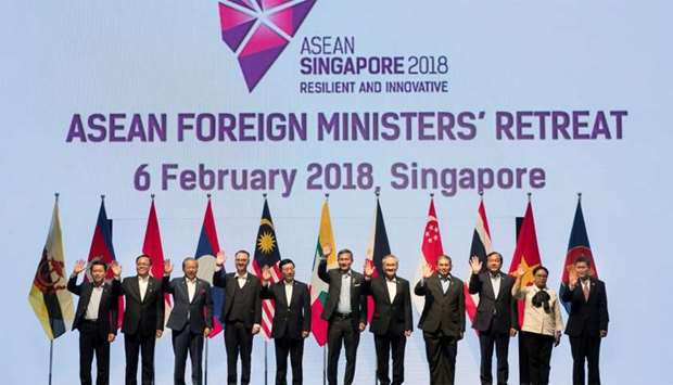 Foreign ministers pose for a group photo at the Association of Southeast Asian Nations (ASEAN) Foreign Ministers' Meeting retreat in Singapore