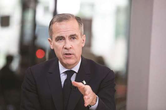 BoE governor Mark Carney gestures while speaking during a Bloomberg Television interview in Paris. The danger of rate hike expectations by investors may be too high for Carney when he presents the banku2019s Inflation Report tomorrow, risking a repeat of the selloff in the pound that followed the BoEu2019s first hike in a decade in November.