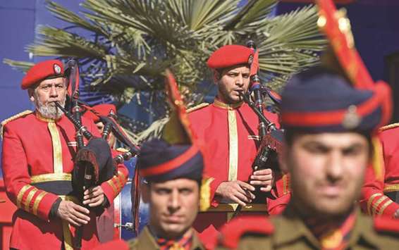 Policemen play bagpipes during a wreath laying ceremony for a slain colleague in Srinagar yesterday.