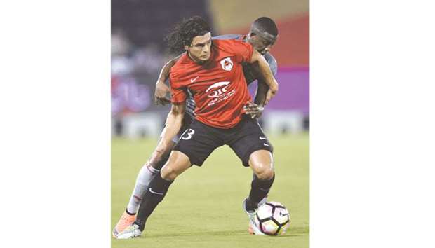Al Rayyanu2019s Sebastian Soria battles for the ball with Lekhwiyau2019s Mohamed Musa during a QNB Stars League match. PICTURE: Noushad Thekkayil