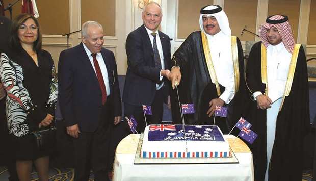 Australian ambassador Axel Wabenhorst is joined by Qataru2019s Minister for Municipality and Environment HE Mohamed bin Abdullah al-Rumaihi in cutting a cake at the Australia Day celebrations yesterday in Doha as Ministry of Foreign Affairsu2019 Protocol Chief Ibrahim Yousuf Fakhroo and other dignitaries look on. PICTURE: Jayaram