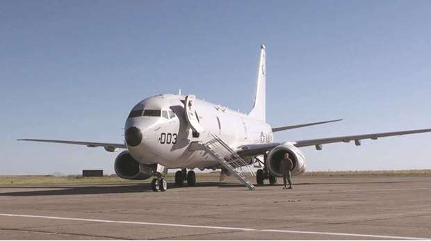 A member of the US Navy stands next to the Boeing P-8A Poseidon plane at a military air base in Bahia Blanca, Argentina. Defence buyers around the region were intrigued by the new aircraft, which was touted as reliable, capable and absolutely necessary in a region abundant with naval tension, both above and below the water.