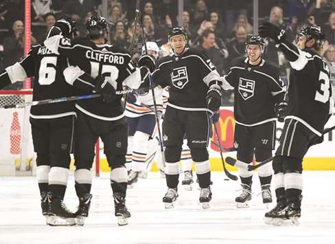 Los Angeles Kings defenseman Jake Muzzin (right) and centre Trevor Lewis (third right) and defenceman Paul LaDue (right) and centre Torrey Mitchell (second right) celebrate with left wing Kyle Clifford after scoring a goal in the first period against the Edmonton Oilers at Staples Centre. PICTURE: USA TODAY Sports