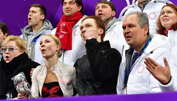 Russia's Evgenia Tarasova (2nd L) and Russia's Vladimir Morozov (2nd R) react after competing in the figure skating team event pair skating short program during the Pyeongchang 2018 Winter Olympic Games at the Gangneung Ice Arena in Gangneung.