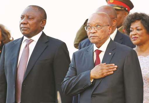 File photo shows Cyril Ramaphosa and President Jacob Zuma standing during the national anthem at the opening of Parliament in Cape Town on February 11, 2016.