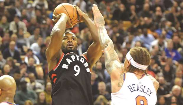 Toronto Raptors forward Serge Ibaka shoots for a basket over New York Knicks forward Michael Beasley in the second-half of their NBA game at Air Canada Centre in Toronto. PICTURE: USA TODAY Sports