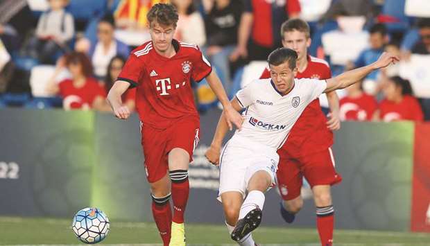 Action from the match between Bayern Munich (in red) and Altinordu (in white) at Al Kass 2019 yesterday.