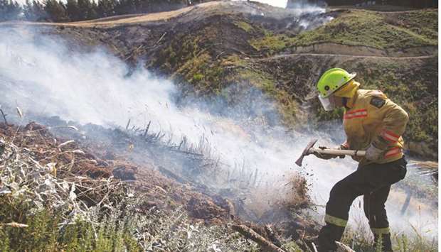 Defence Force firefighters combat the Richmond fire near Nelson, South Island, New Zealand yesterday.