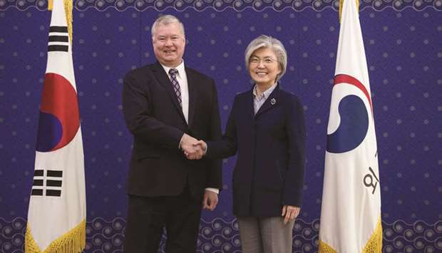 US Special Representative for North Korea Stephen Biegun, left, shakes hands with South Koreau2019s Foreign Minister Kang Kyung-wha during their meeting at the foreign ministry in Seoul yesterday.