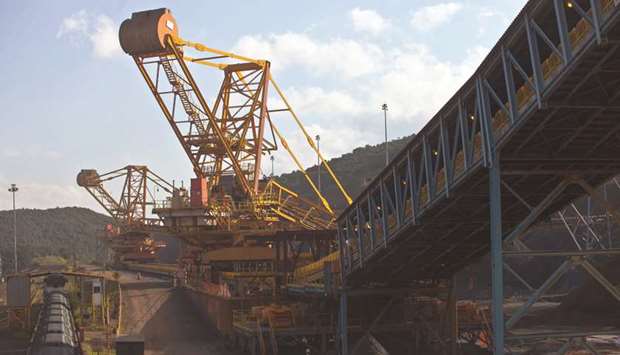 Crushed iron ore fills cargo train wagons aside a conveyor belt at Valeu2019s iron ore Brucutu mine. Iron ore futures surged more than 5% to hit the highest level since 2014 on concern that the increasingly severe crisis at Vale will curtail global supplies, tightening the seaborne market and offsetting the impact of a slowdown in China, the largest importer.