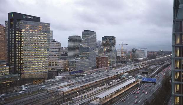 Office and commercial property stand along a highway and railway lines in the Zuidas financial district in Amsterdam. The Netherlands has emerged as one of the winners in securing businesses that seek to leave the UK because of Brexit, vying with countries like Germany, France and Ireland.