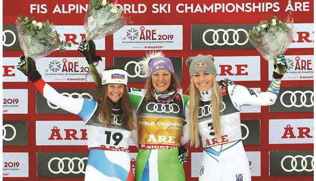 (From left) Silver medallist Switzerlandu2019s Corinne Suter, gold medallist Sloveniau2019s Ilka Stuhec and bronze medallist USAu2019s Lindsey Vonn celebrate on womenu2019s downhill podium of the FIS Alpine World Ski Championships in Are, Sweden, yesterday. (Reuters)