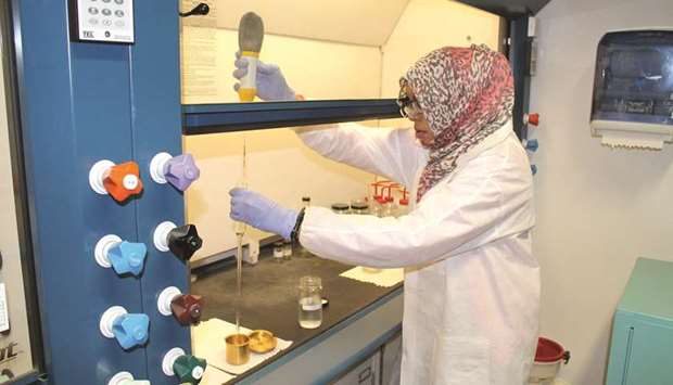 A researcher works on a QNRF-supported project.