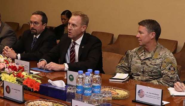 Photo released by Afghanistan's Government Media and Information Center (GMIC) acting Pentagon chief Patrick Shanahan (C) takes part in a meeting next to General Scott Miller (R), commander of US and NATO forces in Afghanistan