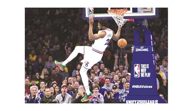 Philadelphia 76ers center Joel Embiid (21) dunks against the Los Angeles Lakers during the first quarter of their game on Sunday. PICTURE: Bill Streicher-USA TODAY Sports