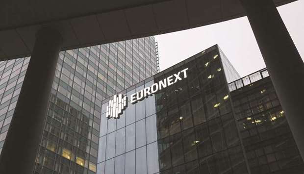 The Euronext logo is seen on the companyu2019s offices in La Defense business district in Paris. Euronext stepped up a struggle with Nasdaq for control of Oslo Bors, raising its bid for Norwayu2019s main stock exchange to about $790mn.