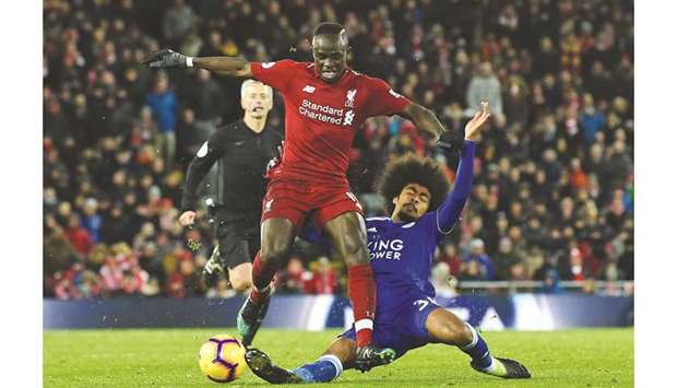 Liverpoolu2019s Sadio Mane (left) is tackled by Leicester Cityu2019s Hamza Choudhury during the English Premier League match at Anfield in Liverpool. (AFP)