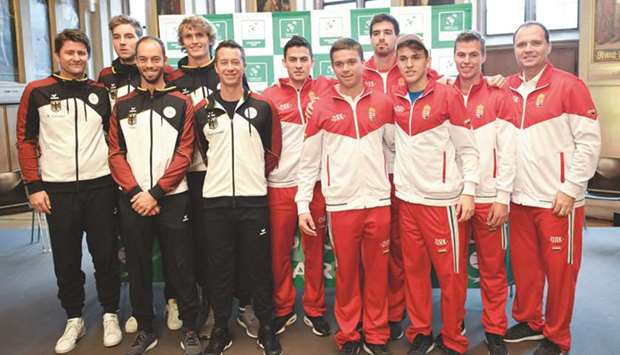 The German (left) and the Hungarian Davis Cup players pose after the draw for the first round encounter at the Emperor Hall of the Roemer medieval building in Frankfurt. (AFP)