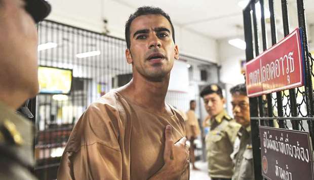 Hakeem al-Araibi is escorted to a courtroom in Bangkok.
