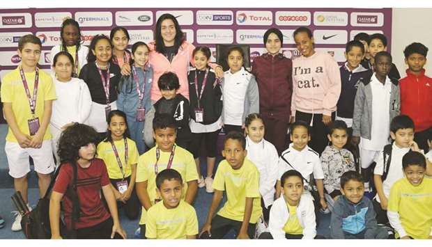 Tunisian tennis star Ons Jabeur (in pink outfit) poses with young players at the Khalifa International Tennis and Squash Complex yesterday.