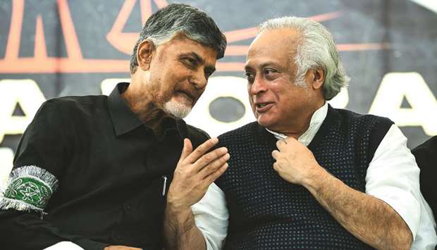 Andhra Pradesh Chief Minister N Chandrababu Naidu (left) speaks to senior Congress leader Jairam Ramesh during a u2018Dharma Porata Deekshau2019 (a day-long hunger strike for justice) launched by Naidu to demand special status for his state, in New Delhi yesterday.
