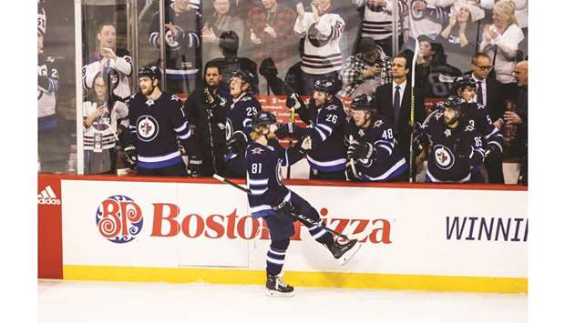 Winnipeg Jets forward Kyle Connor (81) is congratulated by his teammates on his goal against the Columbus Blue Jackets during the third period at Bell MTS Place. PICTURE: USA TODAY Sports