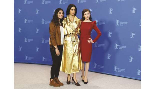 Actresses Cemre Ebuezziya, Ece Yueksel, and Helin Kandemir pose during a photocall to promote the movie K?z Kardesler (A Tale of Three Sisters) at the 69th Berlinale.