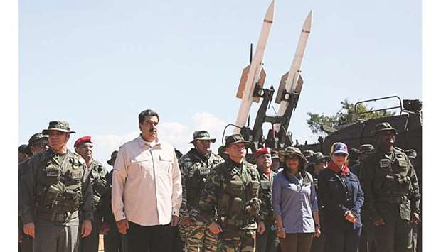 (Left to right) Defence Minister Vladimir Padrino, President Nicolas Maduro, the commandant of the armed forces strategic command operations Remigio Ceballos, Vice-President Delcy Rodriguez, First Lady Cilia Flores and General Jesus Suarez Chourio, general commander of the Bolivarian National Armed Forces, attend a military exercises at Fort Guaicaipuro in Miranda state, Venezuela.