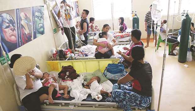 Children with measles fill the paediatric ward of the San Lazaro Hospital in Manila.