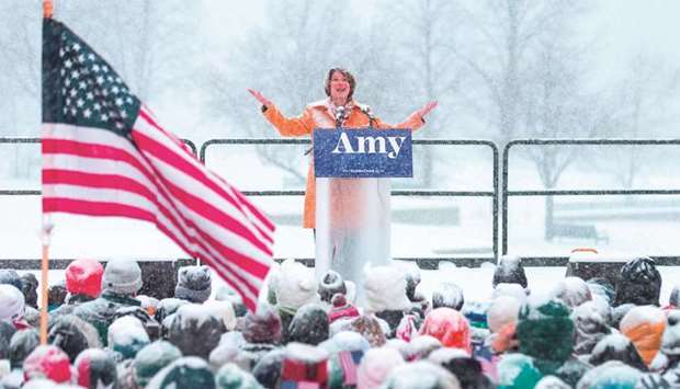 Senator Amy Klobuchar announces her candidacy for president during a snow fall in Minneapolis.