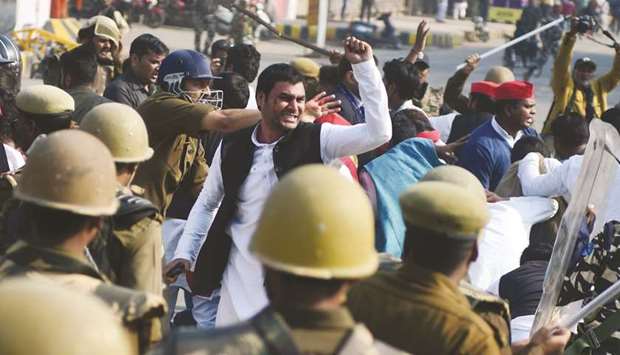 Samajwadi Party workers clash with police during a protest after their party chief Akhilesh Yadav was stopped from boarding a plane at Lucknow airport yesterday.