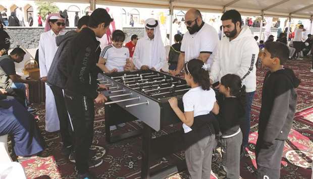 MoCI officials and families at the National Sport Day event.