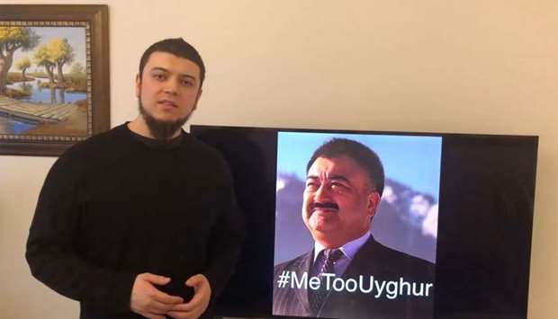 This handout frame grab made from video taken on February 11, 2019 and released by Arslan Hidayat shows Hidayat, the son-in-law of Uighur comedian Adil Mijit (R), calling for a ,proof of life video, of Mijit. AFP/Courtesy of Arslan Hidayat/Handout