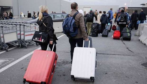 Passengers leave Brussels national airport in Zaventem, on the outskirts of the Belgium capital. AFP