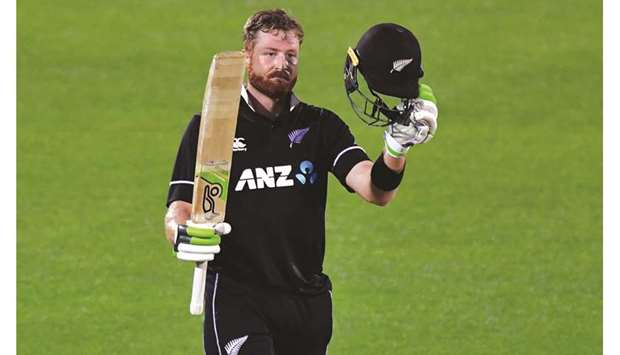 New Zealandu2019s Martin Guptill celebrates his century in the first ODI against Bangladesh in Napier yesterday. (AFP)
