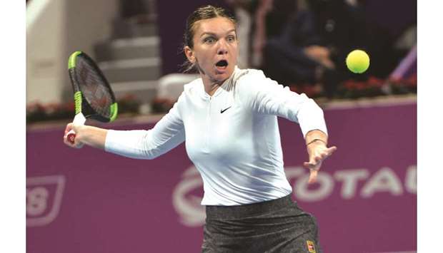 Romaniau2019s Simona Halep in action during her Qatar Total Open match against Ukraineu2019s Lesia Tsurenko (not pictured) at Khalifa International Tennis & Squash Complex here yesterday. PICTURES: Noushad Thekkayil