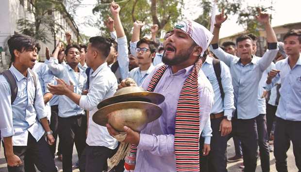 Students shout slogans during a protest to demand the withdrawal of the Citizenship Amendment Bill in Nagaon district in Assam yesterday.